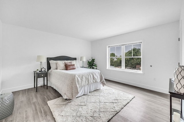 bedroom with wood-type flooring