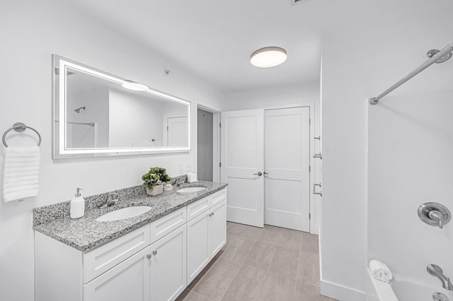 bathroom with vanity and  shower combination