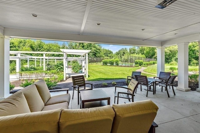 view of patio featuring an outdoor hangout area and fence