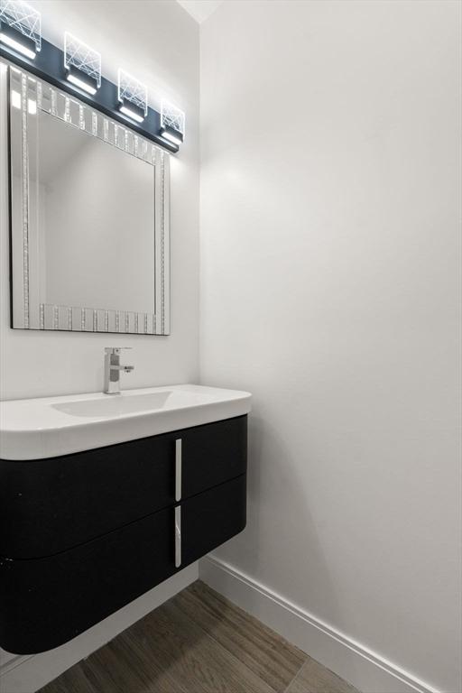 bathroom with vanity and hardwood / wood-style floors