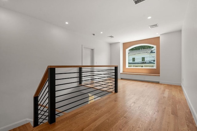 stairs featuring wood-type flooring