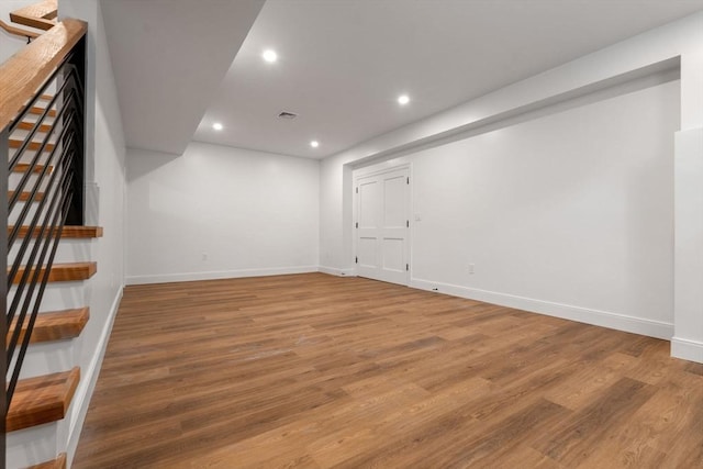 basement featuring wood-type flooring