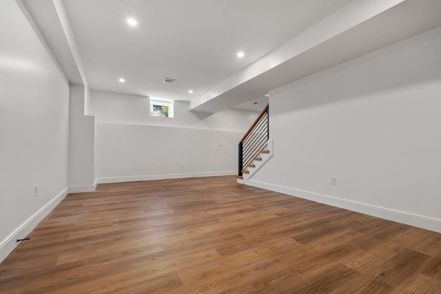 basement featuring wood-type flooring