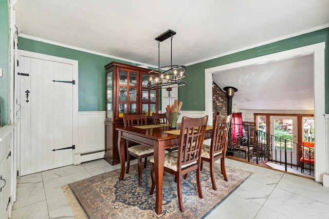 dining room with lofted ceiling, a chandelier, crown molding, a wood stove, and baseboard heating