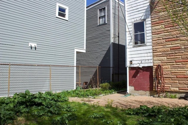 view of property exterior with fence