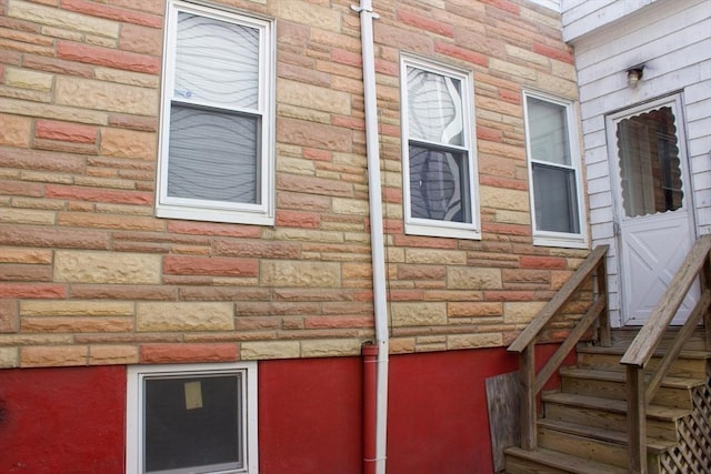 view of side of property featuring stone siding