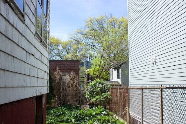 view of property exterior featuring fence
