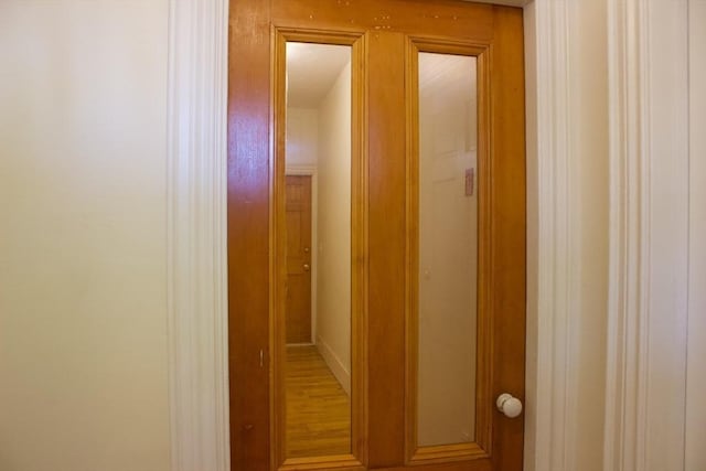 hall featuring wood finished floors