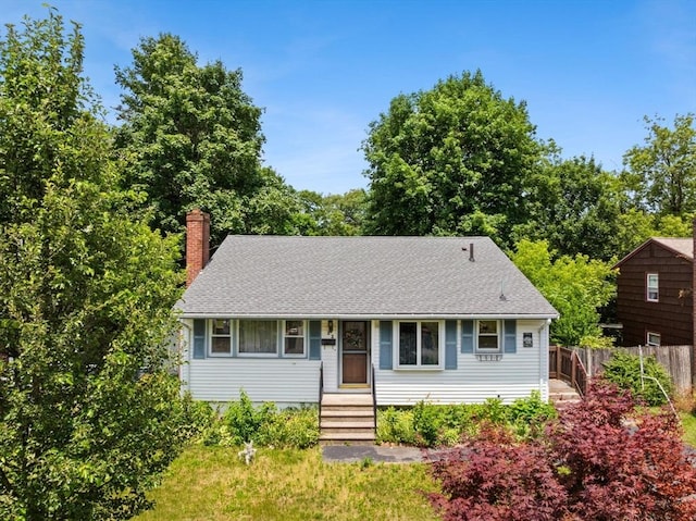 22 Bates St, Brockton, MA 02302 - view of front of property with a chimney and roof with shingles
