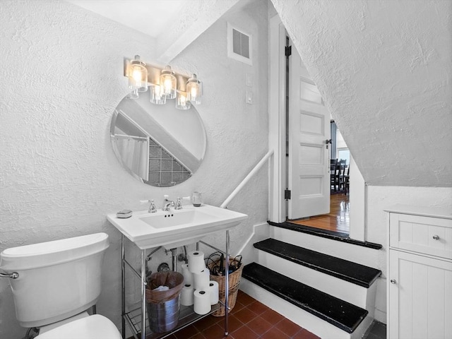 4 Greenough Ave, Boston, MA 02130 - bathroom with a textured wall, toilet, and tile patterned floors