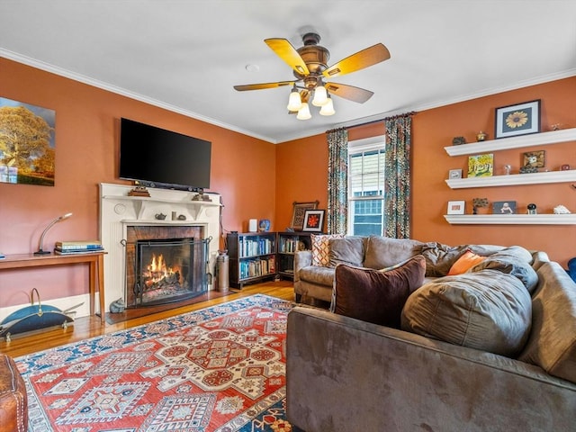 4 Greenough Ave, Boston, MA 02130 - living area with wood finished floors, crown molding, ceiling fan, and a warm lit fireplace