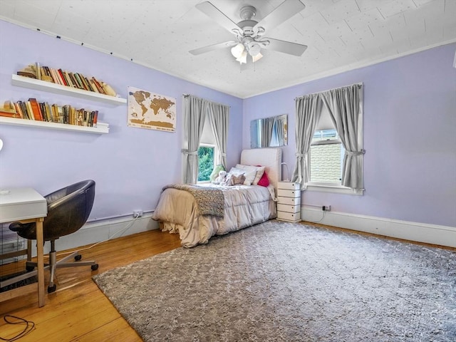 4 Greenough Ave, Boston, MA 02130 - bedroom featuring multiple windows, wood finished floors, and ceiling fan