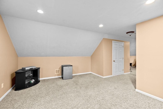 bonus room with carpet and lofted ceiling