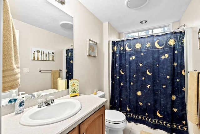 bathroom featuring tile patterned floors, vanity, a shower with shower curtain, and toilet