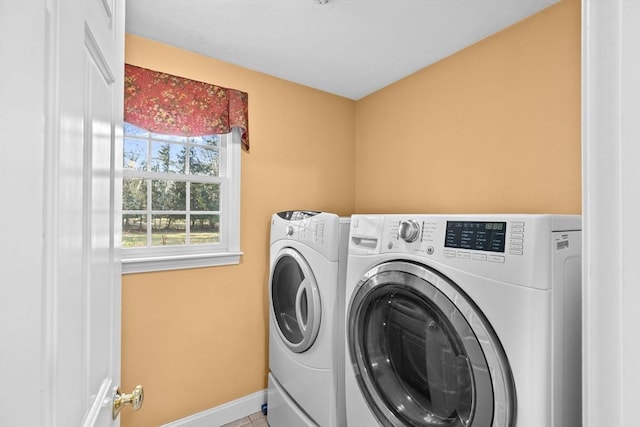 laundry area featuring separate washer and dryer and tile patterned floors