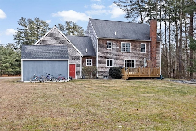 back of property with a yard and a deck