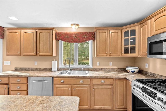 kitchen with sink and appliances with stainless steel finishes