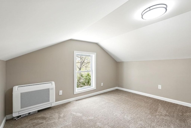bonus room featuring baseboards, heating unit, and carpet
