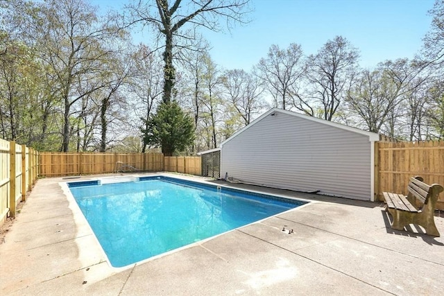 view of swimming pool featuring a fenced in pool, a fenced backyard, and a patio area