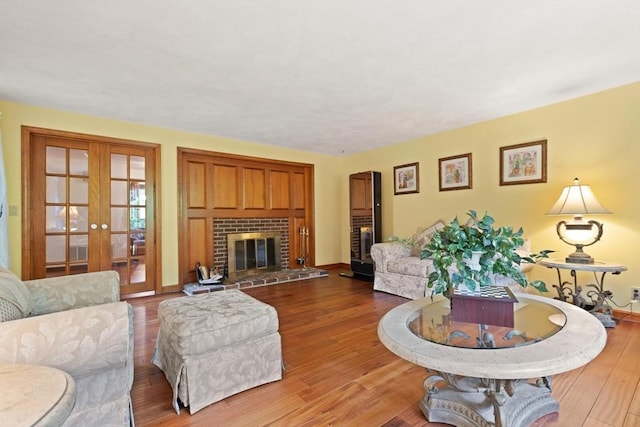 41B Washington St, Boxford, MA 01921 - living area featuring french doors, wood finished floors, and a fireplace
