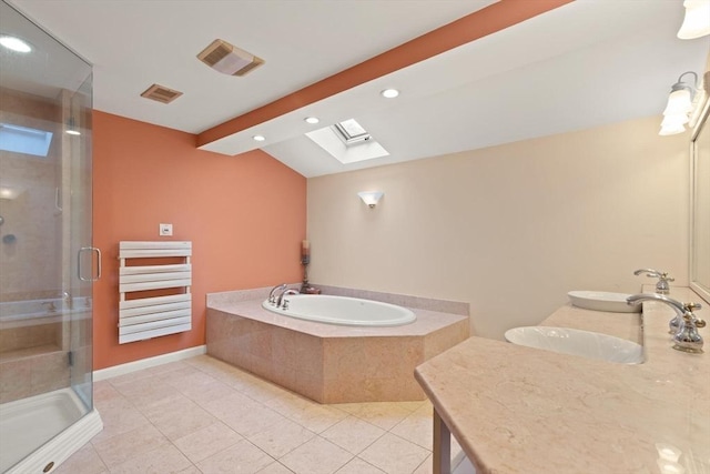 41B Washington St, Boxford, MA 01921 - full bathroom with a garden tub, double vanity, a shower stall, recessed lighting, and a skylight
