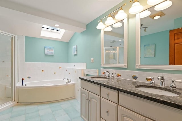 41B Washington St, Boxford, MA 01921 - full bath with a skylight, a shower stall, a garden tub, double vanity, and tile patterned floors