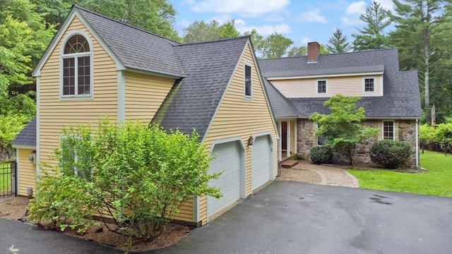 41B Washington St, Boxford, MA 01921 - view of front of property with a chimney, stone siding, asphalt driveway, and roof with shingles