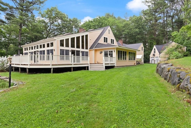 41B Washington St, Boxford, MA 01921 - rear view of house with a sunroom, a chimney, a wooden deck, and a yard