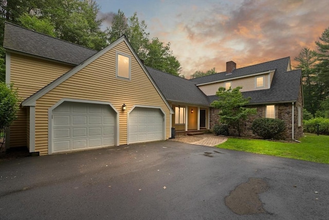 41B Washington St, Boxford, MA 01921 - view of front of property featuring a chimney, a garage, driveway, roof with shingles, and stone siding