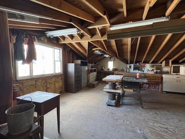 miscellaneous room featuring lofted ceiling