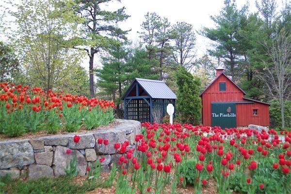 view of home's community featuring an outdoor structure