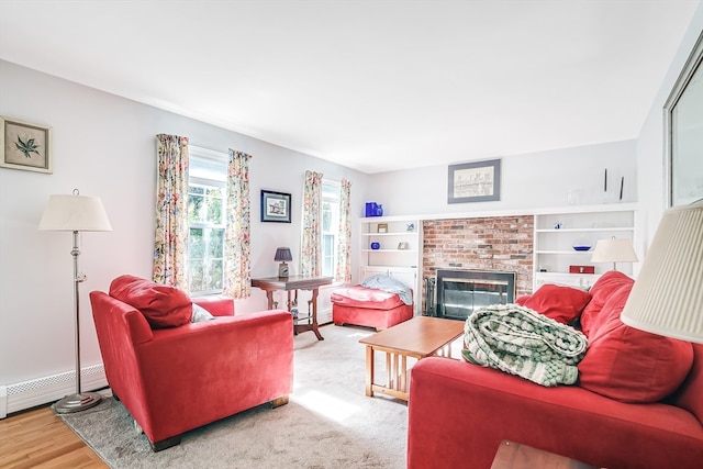 living room featuring wood-type flooring and a fireplace