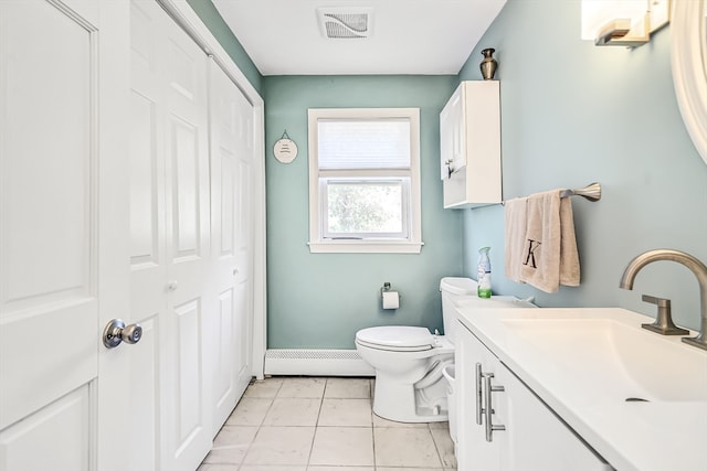 bathroom featuring vanity, tile patterned flooring, toilet, and a baseboard heating unit