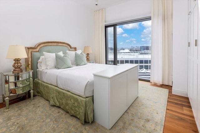 bedroom with light wood-type flooring