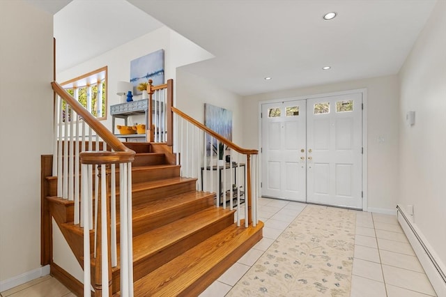 foyer entrance featuring stairs, baseboards, baseboard heating, recessed lighting, and light tile patterned floors