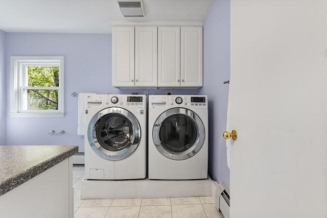 clothes washing area with visible vents, marble finish floor, baseboard heating, separate washer and dryer, and cabinet space