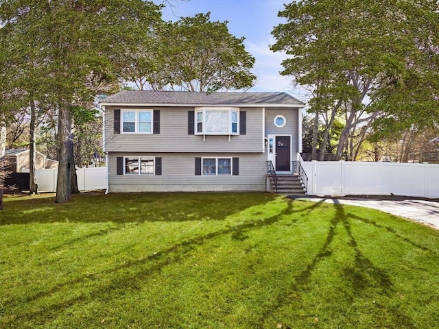 bi-level home with a front yard