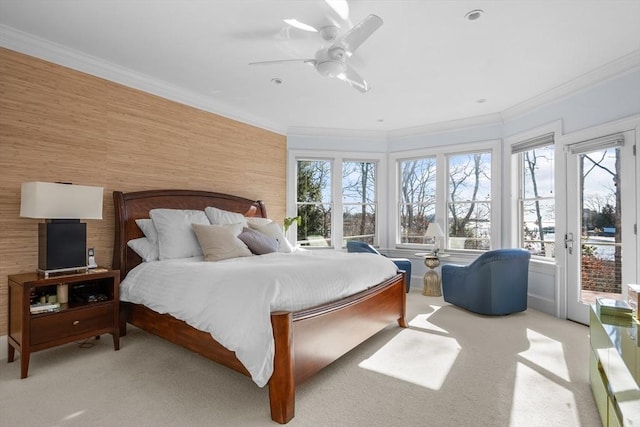 bedroom featuring access to outside, a ceiling fan, light colored carpet, and crown molding