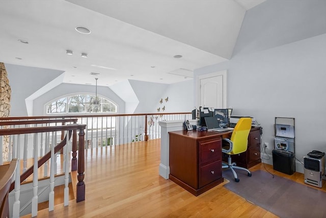 home office featuring lofted ceiling and light wood-type flooring