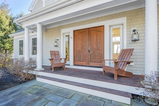 doorway to property with covered porch