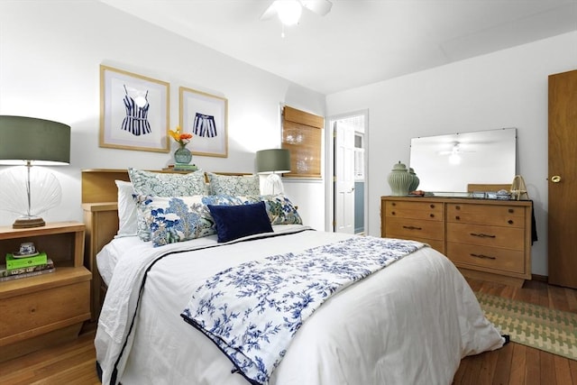 bedroom featuring wood-type flooring and a ceiling fan