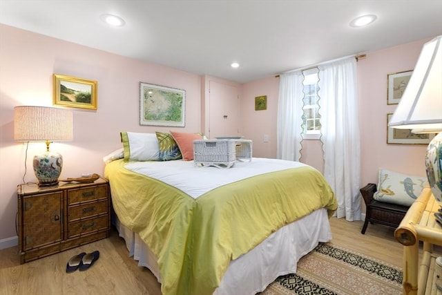 bedroom featuring light wood-style flooring and recessed lighting