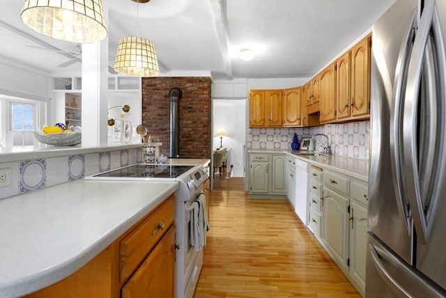 kitchen with white appliances, light wood-style floors, tasteful backsplash, light countertops, and beamed ceiling