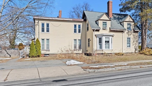 view of front of property featuring a chimney