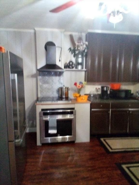 6 Elm St, Barre, MA 01005 - kitchen featuring stainless steel appliances, wall chimney exhaust hood, dark wood-style flooring, ceiling fan, and white cabinets