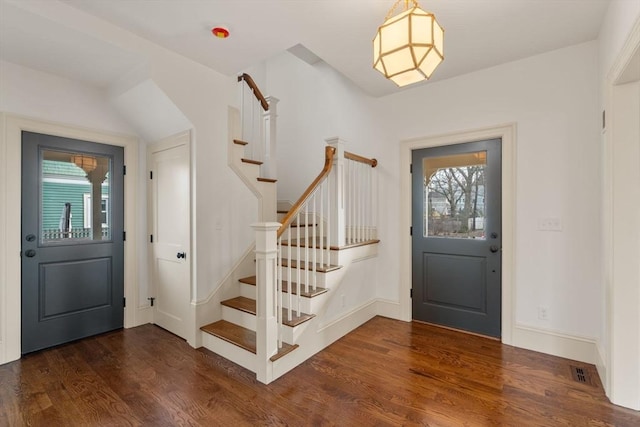 foyer entrance featuring dark hardwood / wood-style flooring and plenty of natural light