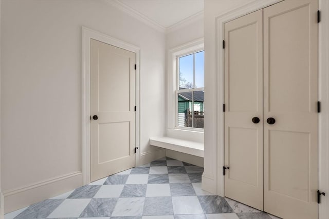 hall with a wealth of natural light and ornamental molding