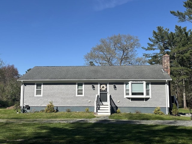 231 Mattapoisett Rd, Acushnet, MA 02743 - view of front facade with entry steps, a chimney, a shingled roof, and a front lawn