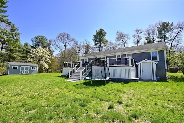 231 Mattapoisett Rd, Acushnet, MA 02743 - back of house with a lawn, an outdoor structure, a deck, and a shed