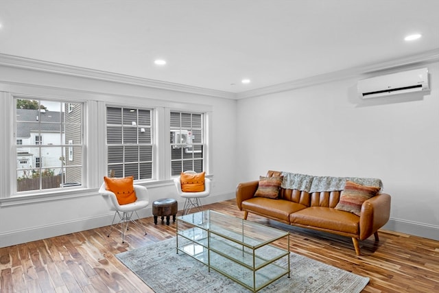 living room with wood-type flooring, a wall unit AC, and crown molding